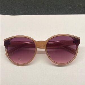 Vince Camuto Tan Sunglasses with brown lenses.